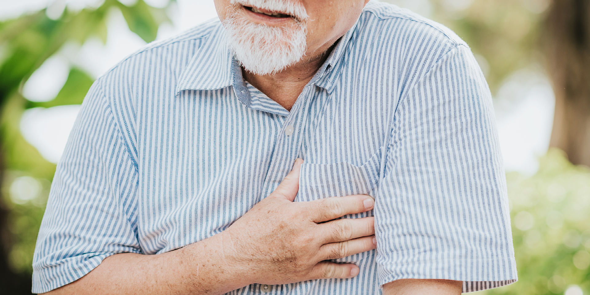Man clutching chest