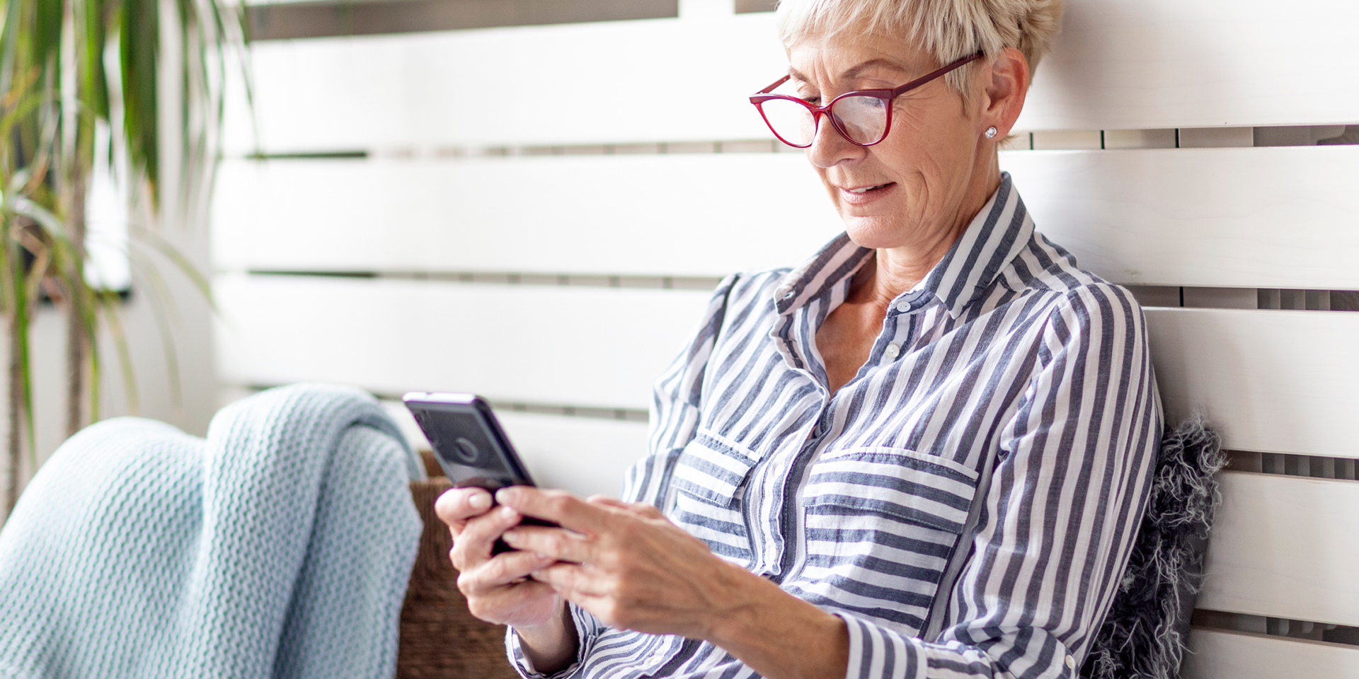 Woman looking at her iPhone