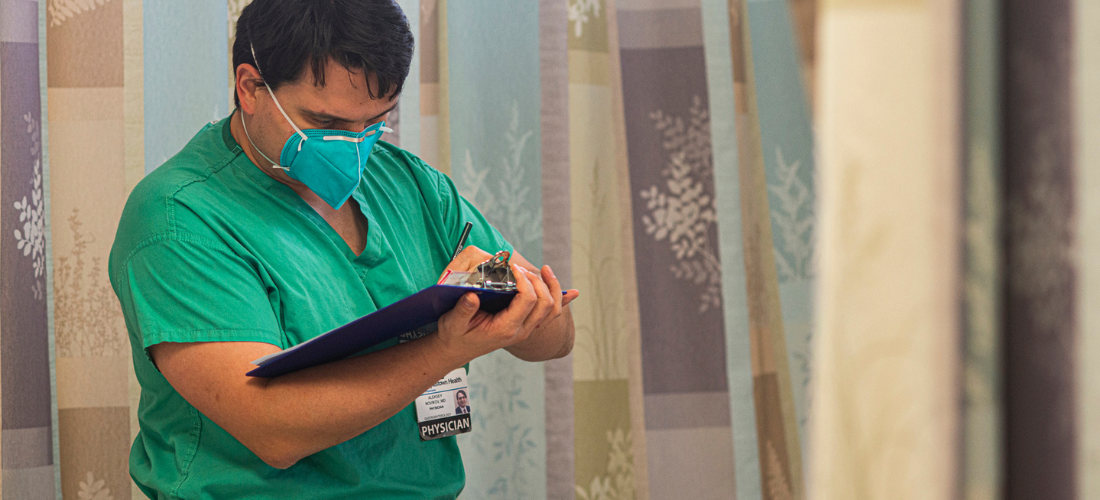 Gastroenterology doctor reviewing patient information before a procedure | Doylestown Health